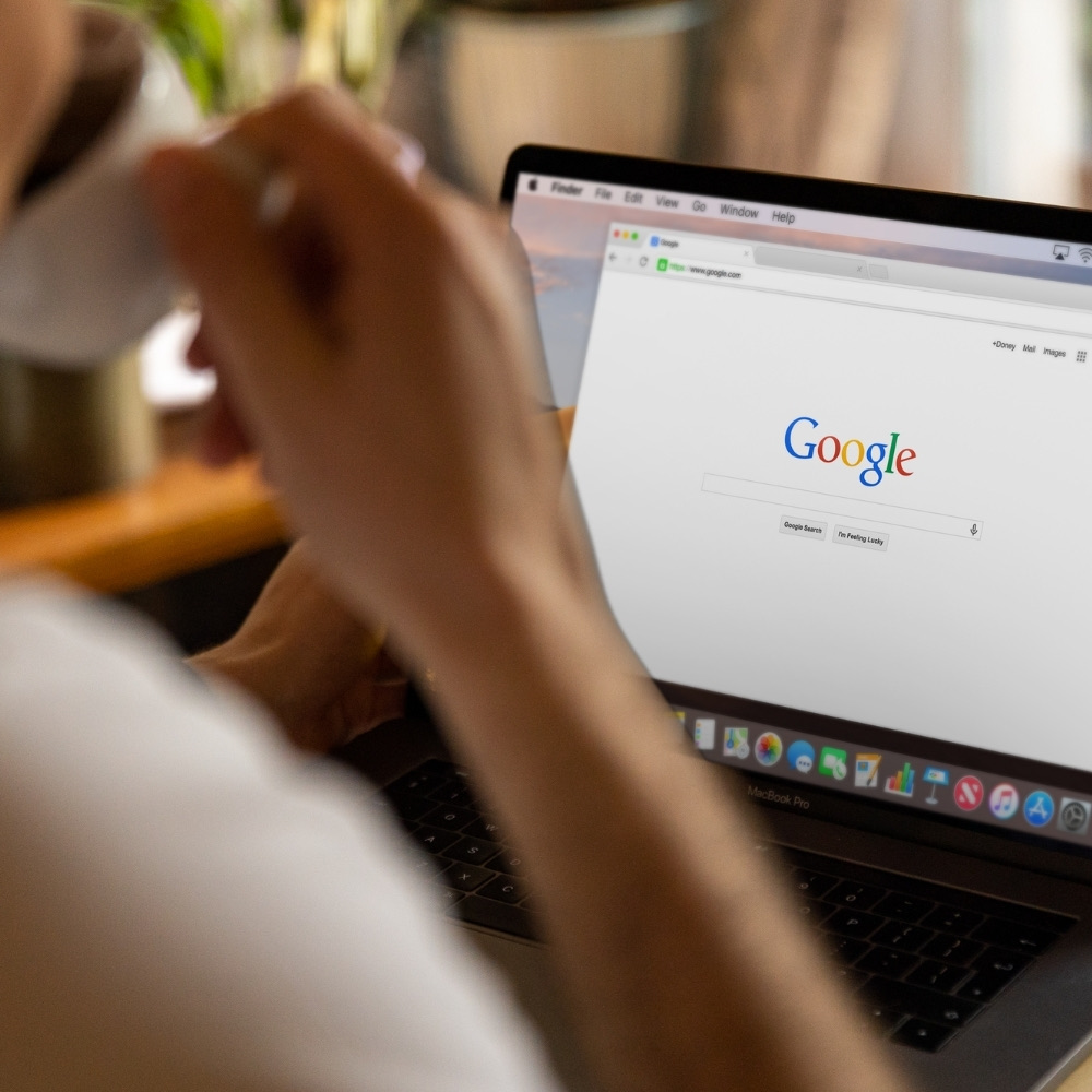 Person at a laptop with a Google search page open