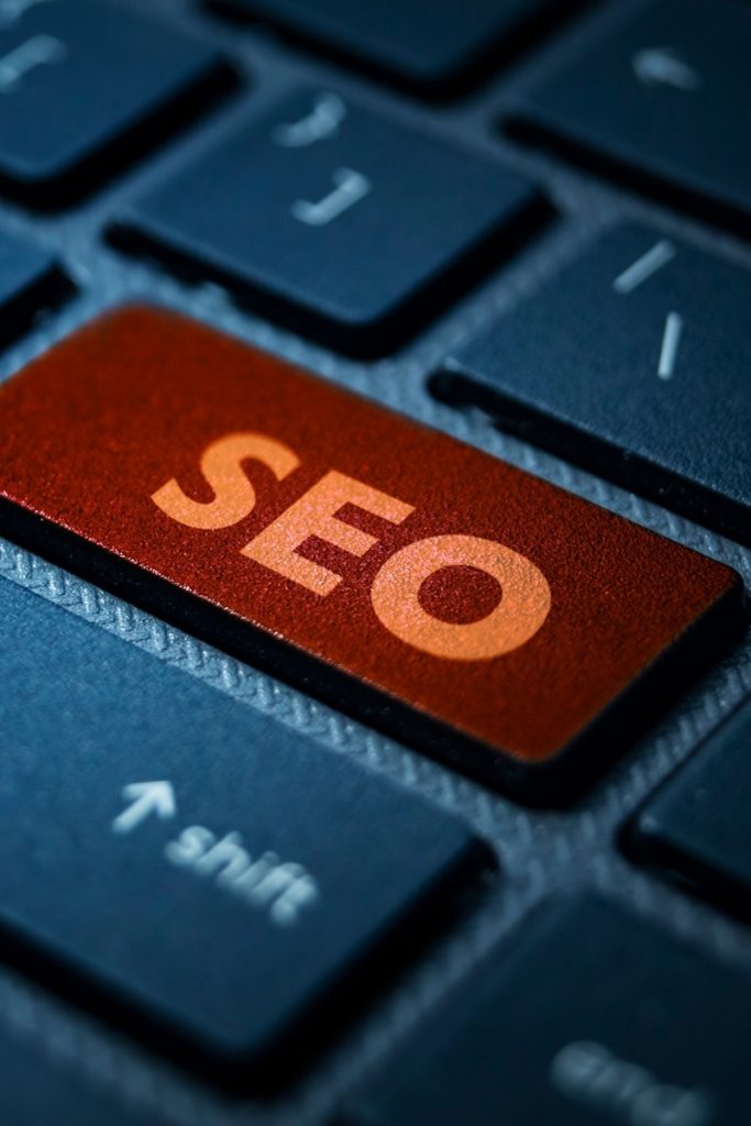 Orange SEO key amid a computer keyboard